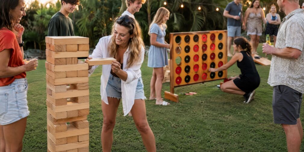 Friends at a party playing giant lawn games