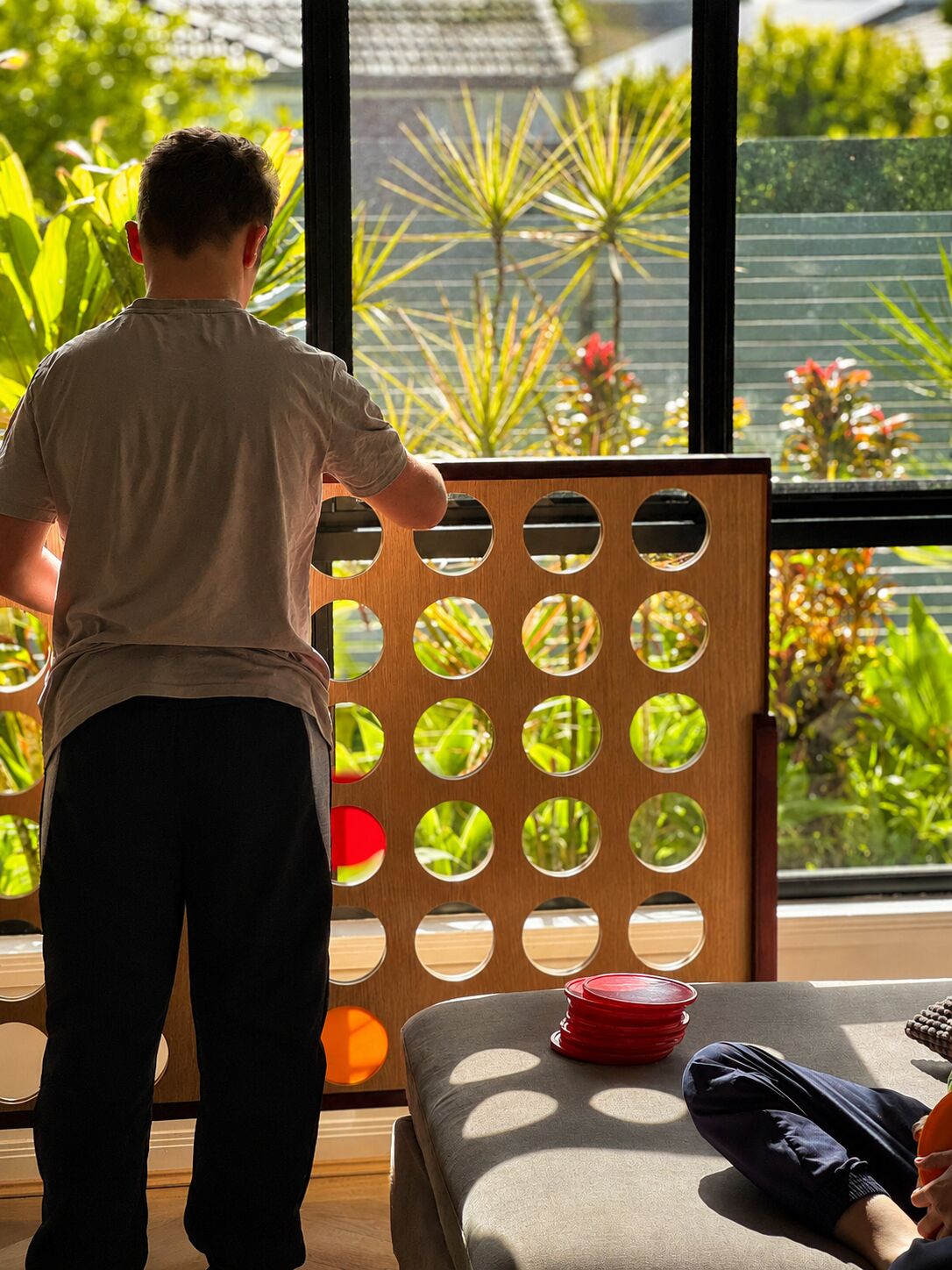 Kids playing Connect 4 indoors